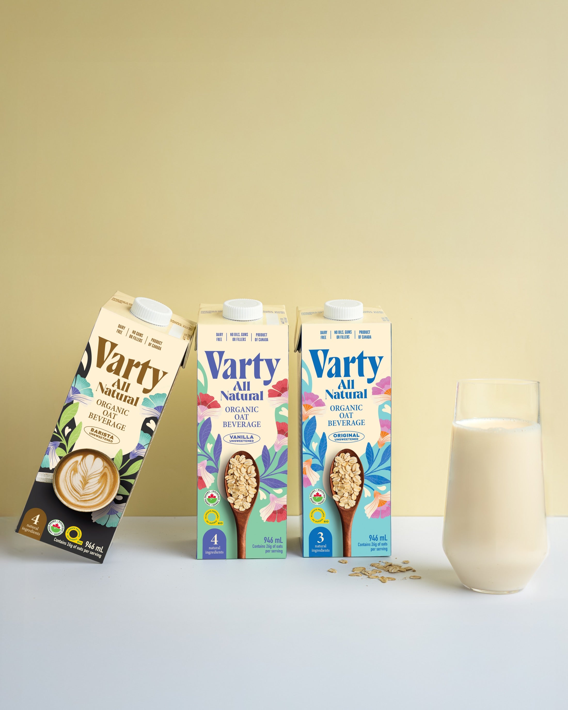 Varty cartons with a glass of oat beverage