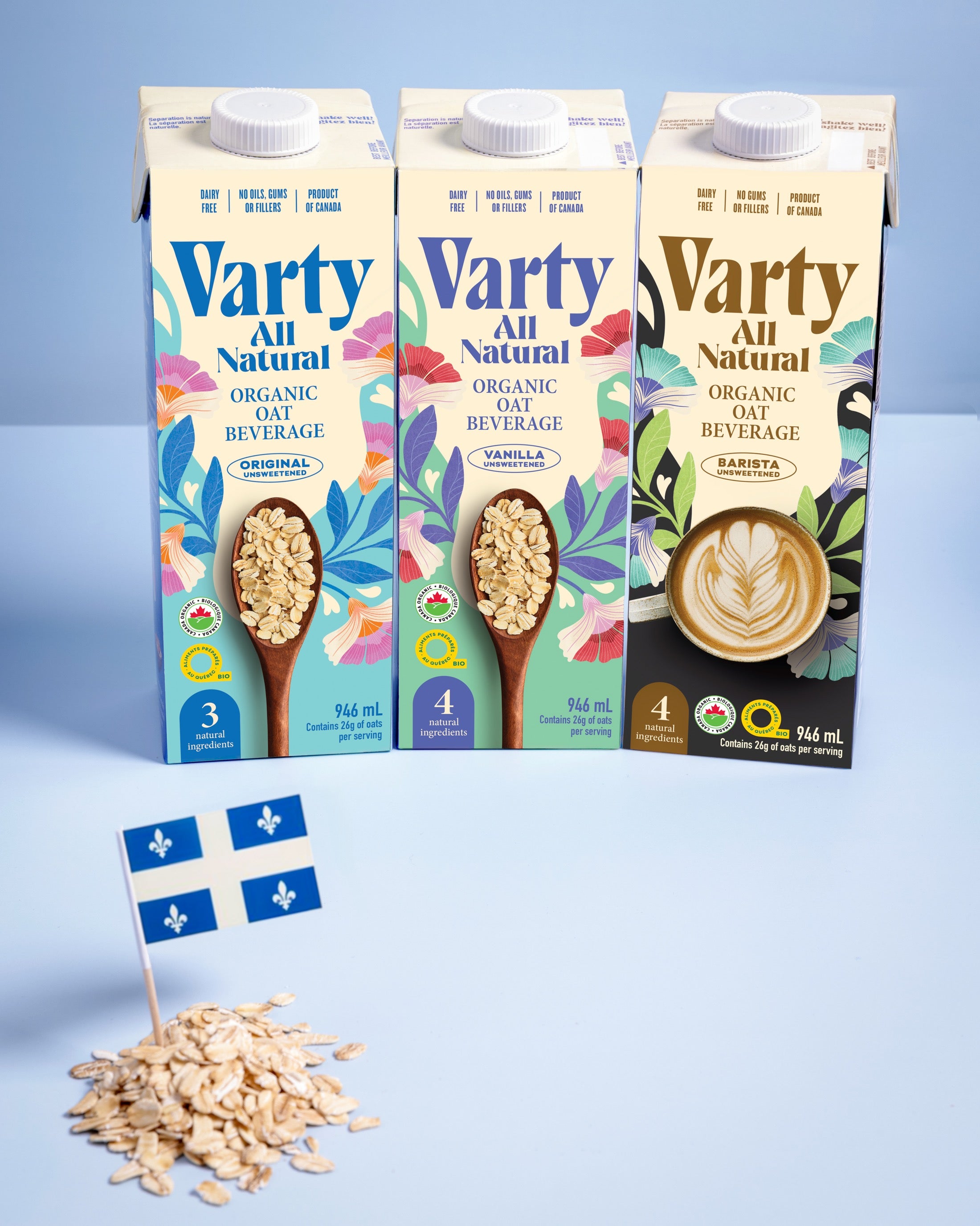 Three Varty oat beverage cartons with Quebec flag illustration